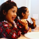 Sisters Brushing Teeth